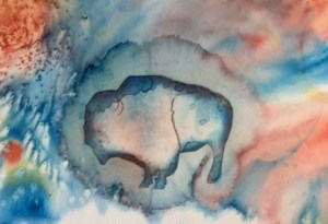Pattern stain with plastic cut out of a buffalo.